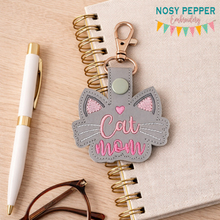 Load image into Gallery viewer, Cat Mom snap tab and eyelet fob machine embroidery file (single and multi files included)  DIGITAL DOWNLOAD