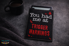 Load image into Gallery viewer, Trigger Warnings reader sleeve (3 sizes included) machine embroidery design DIGITAL DOWNLOAD