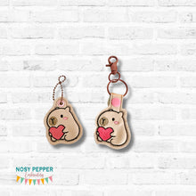 Load image into Gallery viewer, Capybara Heart snap tab and eyelet fob set (single and multi files included) machine embroidery design DIGITAL DOWNLOAD