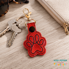 Load image into Gallery viewer, Paw Print Minimalist Snap tab 4x4 machine embroidery design DIGITAL DOWNLOAD