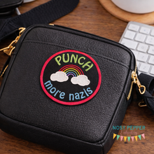 Load image into Gallery viewer, Black bag with a colorful patch on a wooden surface