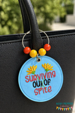 Load image into Gallery viewer, Surviving Out Of Spite bag tag/ornament/bookmark machine embroidery design DIGITAL DOWNLOAD