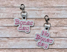 Load image into Gallery viewer, Bones day/No Bones day snap tab (includes 2 designs and single and multi files) machine embroidery design DIGITAL DOWNLOAD